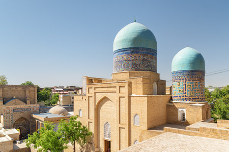 Awesome view of the Shah-i-Zinda Ensemble in Samarkand, Uzbekistan. Mausoleums decorated by blue tiles with designs. The necropolis is a popular tourist attraction of Central Asia.の写真素材