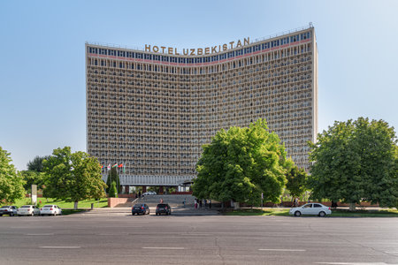 Tashkent, Uzbekistan - 8 September, 2022: Awesome view of facade of Hotel Uzbekistan. The famous hotel located on the Amir Timur Square. Tashkent is a popular tourist destination of Central Asia.のeditorial素材
