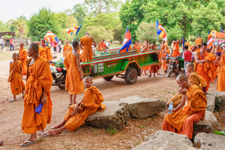 Siem Reap, Cambodia - May 2, 2015: Buddhist monks in ancient Angkor Wat temple. Angkor Wat is a popular destination of tourists and pilgrims.のeditorial素材