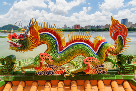 Kaohsiung, Taiwan - April 30, 2019: Colorful detail of the Dragon and Tiger Pagodas at Lotus Lake. Awesome dragon sculpture. The temple is a popular tourist attraction of Asia.のeditorial素材