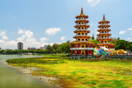 Kaohsiung, Taiwan - April 30, 2019: Unusual view of the Dragon and Tiger Pagodas at Lotus Lake. The temple is a popular tourist attraction of Asia.のeditorial素材