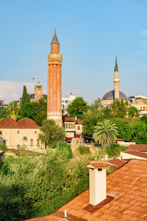 Awesome view of the Yivli Minare Mosque (Alaaddin Mosque) in Kaleici of Antalya, Turkey. The Kaleici area is the historic city center. The fluted minaret is a popular tourist attraction in Turkey.の写真素材