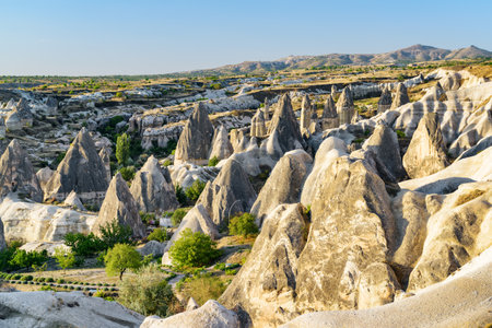 Awesome view of rock formations called the Fairy Chimneys in Cappadocia, Turkey. Fabulous landscape of Goreme Historical National Park. Cappadocia is a popular tourist destination of Turkey.の写真素材