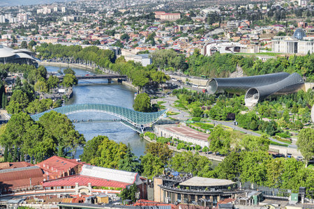 Awesome city view of Tbilisi, Georgia. The Bridge of Peace over the Kura (Mtkvari) River and Center of perfoming arts are visible in the middle. Amazing cityscape.の写真素材