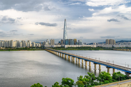 Awesome view of skyscraper and Jamsil Railway Bridge over the Han River (Hangang) in Seoul, South Korea. Amazing cityscape. Seoul is a popular tourist destination of Asia.の写真素材