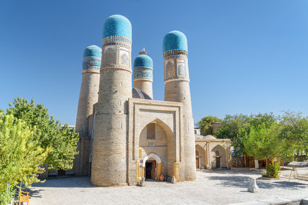 Awesome view of Chor Minor (the Madrasah of Khalif Niyaz-kul) in Bukhara, Uzbekistan. The historic gatehouse with four towers is a popular tourist attraction of Central Asia.の写真素材