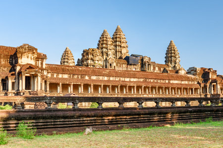 East facade of ancient temple complex Angkor Wat in Siem Reap, Cambodia. Mysterious Angkor Wat is a popular tourist attraction.の写真素材
