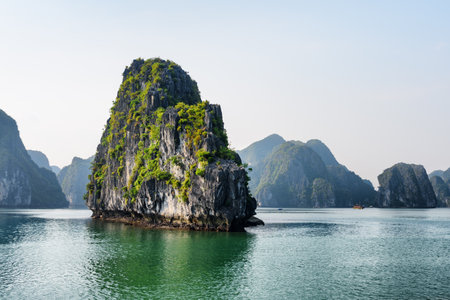 Scenic karst isle in the Ha Long Bay, Vietnam. The Halong Bay is a popular tourist destination of Asia.の写真素材
