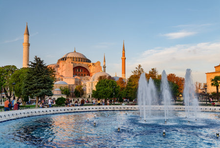 Fountain at Sultanahmet Square and the Hagia Sophia in Istanbul, Turkey. The Sultanahmet Square is a popular tourist attraction of Istanbul.の写真素材
