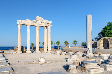 Awesome ruins of the Temple of Apollo on the Mediterranean Sea coast in Side, Turkey. The Roman temple is a popular tourist attraction in Turkey. Amazing view of columns on sunny day.の写真素材