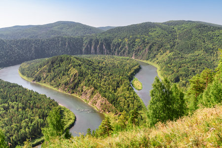 Awesome view of scenic river among evergreen woods. Awesome landscape.の写真素材