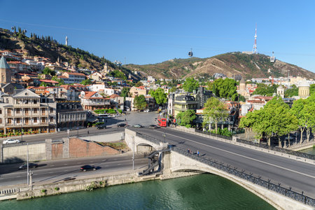 Awesome view of the Metekhi Bridge over the Kura (Mtkvari) River in Old Town of Tbilisi, Georgia. Tbilisi is a popular tourist destination of the Caucasus region.の写真素材