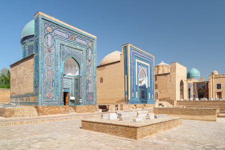 Awesome view of the Shah-i-Zinda Ensemble in Samarkand, Uzbekistan. Mausoleums decorated by blue tiles with designs. The necropolis is a popular tourist attraction of Central Asia.の写真素材