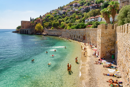 Alanya, Turkey - October 5, 2021: Awesome view of the Tersane and the beach by the coast of Alanya, Turkey. Amazing coastline. The ancient shipyard is a popular tourist attraction in Turkey.のeditorial素材