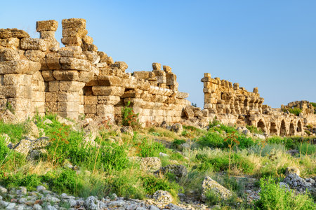 Awesome view of the ancient city walls in Side, Turkey. The amazing ruins are a popular tourist attraction of the world.の写真素材