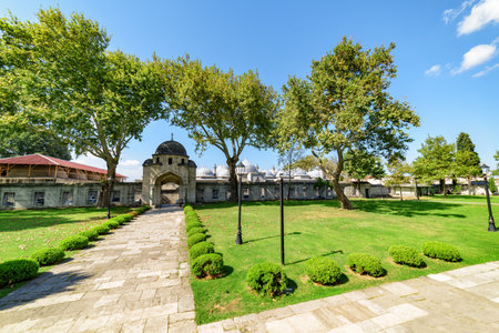 Awesome view of a scenic gate to the green gardens of the Suleymaniye Mosque in Istanbul, Turkey. The Ottoman imperial mosque is a popular destination among pilgrims and tourists of the world.の写真素材