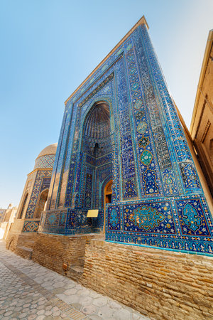 View of the Shah-i-Zinda Ensemble in Samarkand, Uzbekistan. Mausoleums decorated by blue tiles with designs. The necropolis is a popular tourist attraction of Central Asia.の写真素材