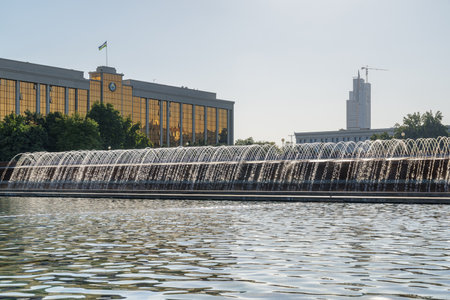 Awesome view of Mustaqillik Fountain and the Cabinet of Ministries building in Tashkent, Uzbekistan. The capital and largest city of Uzbekistan is a popular tourist destination of Central Asia.の写真素材