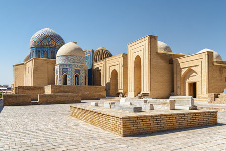 Awesome view of the Shah-i-Zinda Ensemble in Samarkand, Uzbekistan. Mausoleums decorated by blue tiles with designs. The necropolis is a popular tourist attraction of Central Asia.の写真素材