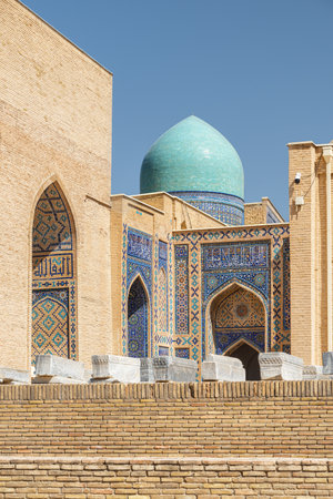 Awesome view of the Shah-i-Zinda Ensemble in Samarkand, Uzbekistan. Mausoleums decorated by blue tiles with designs. The necropolis is a popular tourist attraction of Central Asia.の写真素材