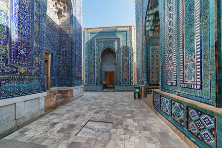 Awesome view of the upper group of mausoleums at the Shah-i-Zinda Ensemble in Samarkand, Uzbekistan. Mausoleums decorated by blue tiles with designs are a popular tourist attraction of Central Asia.の写真素材