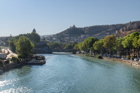 Awesome view of the Virgin Mary Assumption Church of Metekhi and the Metekhi Bridge over the Kura (Mtkvari) River in Old Town of Tbilisi, Georgia. Tbilisi is a popular tourist destination.の写真素材