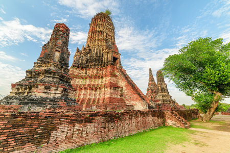 Towers (prangs) of Wat Chaiwatthanaram in Ayutthaya, Thailand. Scenic ruins of buddhist temple in the ancient city of the Ayutthaya Kingdom (Siam). Thailand is a popular tourist destination of Asia.の写真素材