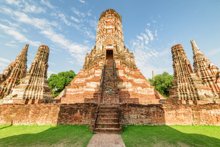 Towers (prangs) of Wat Chaiwatthanaram in Ayutthaya, Thailand. Scenic ruins of buddhist temple in the ancient city of the Ayutthaya Kingdom (Siam). Thailand is a popular tourist destination of Asia.の写真素材