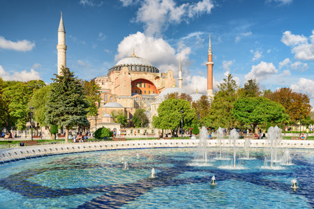 Fountain at Sultanahmet Square and the Hagia Sophia in Istanbul, Turkey. The Sultanahmet Square is a popular tourist attraction of Istanbul.の写真素材