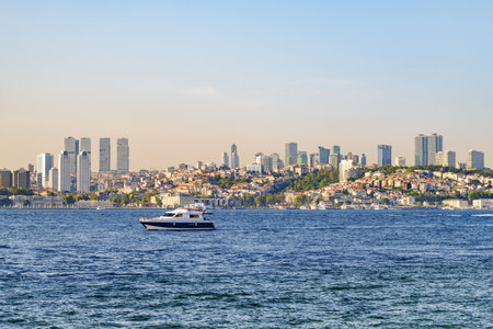 Unusual Istanbul skyline, Turkey. Boat is crossing the Bosporus. Awesome view of the modern buildings of Istanbul.の写真素材