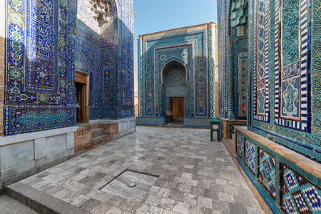 Awesome view of the upper group of mausoleums at the Shah-i-Zinda Ensemble in Samarkand, Uzbekistan. Mausoleums decorated by blue tiles with designs are a popular tourist attraction of Central Asia.の写真素材