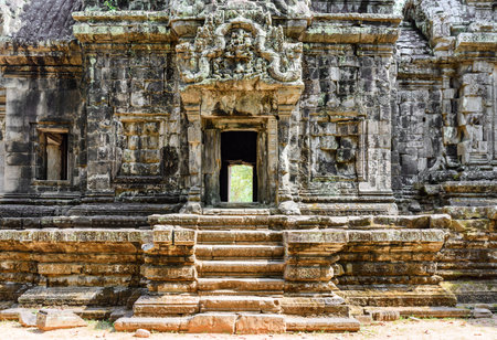 Ancient buildings of Thommanon temple in enigmatic Angkor, Siem Reap, Cambodia. Mysterious Thommanon nestled among rainforest. Angkor wat is a popular tourist attraction.の写真素材