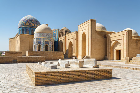Awesome view of the Shah-i-Zinda Ensemble in Samarkand, Uzbekistan. Mausoleums decorated by blue tiles with designs. The necropolis is a popular tourist attraction of Central Asia.の写真素材