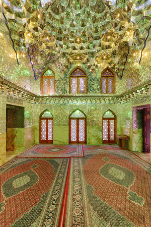 Shiraz, Iran - 29 October, 2018: Wonderful interior of prayer hall in Ali Ibn Hamzeh Holly Shrine. Ceiling and walls of the Muslim place covered with glass and mirror tiles. Shimmering mosaic.のeditorial素材