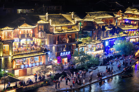 Fenghuang, China - September 23, 2017: Fabulous aerial night view of Phoenix Ancient Town and the Tuojiang River (Tuo Jiang River). Fenghuang is a popular tourist destination of Asia.のeditorial素材