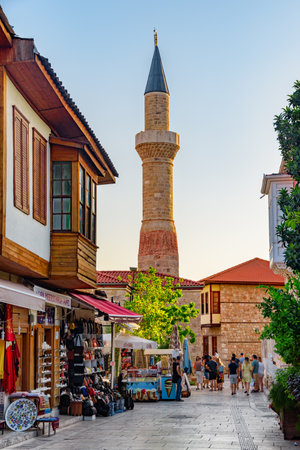 Antalya, Turkey - September 28, 2021: Awesome view of the Kesik Minare and an old street in Kaleici. The Kaleici area is the historic city center and a popular tourist attraction in Turkey.のeditorial素材