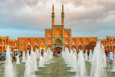 Yazd, Iran - 26 October, 2018: Gorgeous view of the Amir Chakhmaq Complex and beautiful fountain in the historical city of Yazd at sunset. Unique Persian architecture of the ancient town.のeditorial素材