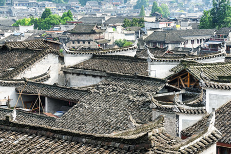Awesome view of traditional Chinese black tile roofs of authentic buildings Phoenix Ancient Town (Fenghuang County), China. Fenghuang is a popular tourist destination of Asia.の写真素材