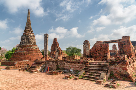 Scenic ruins of the Wat Mahathat in Ayutthaya, Thailand. Amazing view of the Buddhist temple in the ancient city and capital of the Ayutthaya Kingdom or Siam. Thailand is a popular tourist destinationの写真素材
