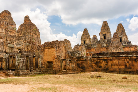Mysterious ruins of ancient Pre Rup temple in amazing Angkor, Siem Reap, Cambodia. Enigmatic Pre Rup  nestled among rainforest. Angkor is a popular tourist attraction.の写真素材