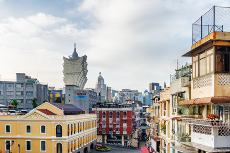 Macau - October 18, 2017: View of Grand Lisboa Casino tower among city buildings. . Macau is a...