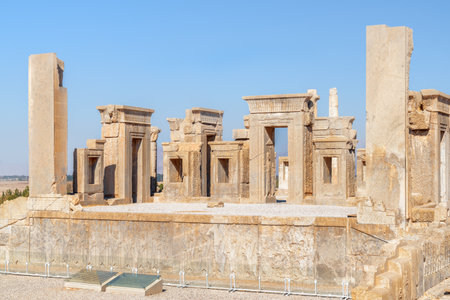 Unusual view of ruins of the Tachara Palace on blue sky background in Persepolis, Iran. The most intact of all ruins at the ceremonial capital of the Achaemenid Empire. Ancient Persian city.の写真素材