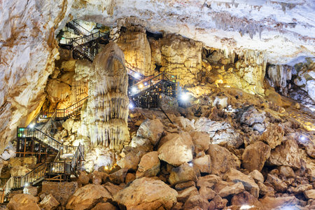 Amazing view of wooden stairs leading to exit from Paradise Cave (Thien Duong Cave) at Phong Nha-Ke Bang National Park in Vietnam. Paradise Cave is a popular tourist attraction of Asia.の写真素材