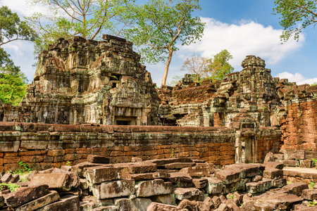 Mysterious ruins of ancient Preah Khan temple in amazing Angkor in morning sun. Siem Reap, Cambodia. Enigmatic Preah Khan nestled among rainforest. Angkor is a popular tourist attraction.の写真素材