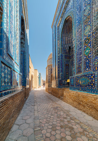 View of the Shah-i-Zinda Ensemble in Samarkand, Uzbekistan. Mausoleums decorated by blue tiles with designs. The necropolis is a popular tourist attraction of Central Asia.の写真素材
