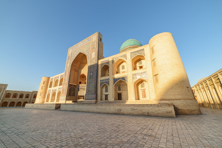 Awesome view of the Mir-i-Arab Madrasa at Po-i-Kalan complex in Bukhara, Uzbekistan. The ensemble is a popular tourist attraction of Central Asia.の写真素材
