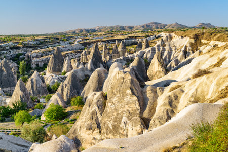 Awesome view of rock formations called the Fairy Chimneys in Cappadocia, Turkey. Fabulous landscape of Goreme Historical National Park. Cappadocia is a popular tourist destination of Turkey.の写真素材