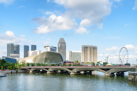 Scenic view of skyscrapers and other modern buildings beside Marina Bay with azure water in Singapore. Beautiful summer cityscape. Singapore skyline. Singapore is a popular tourist destination of Asiaの写真素材