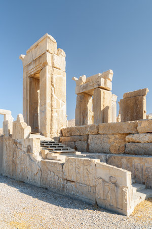 Awesome view of ruins of the Tachara Palace on blue sky background in Persepolis, Iran. The most intact of all ruins at the ceremonial capital of the Achaemenid Empire. Ancient Persian city.の写真素材