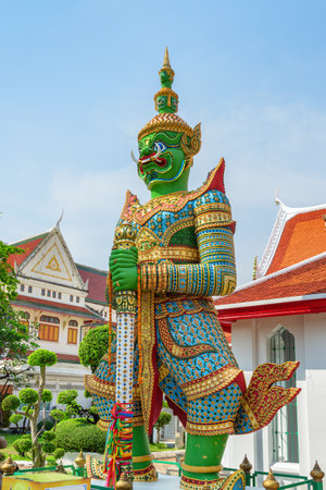 Bangkok, Thailand - 20 February, 2023: Awesome view of yaksha guardian statue at Wat Arun. The Buddhist temple is a popular tourist attraction of Asia.の写真素材